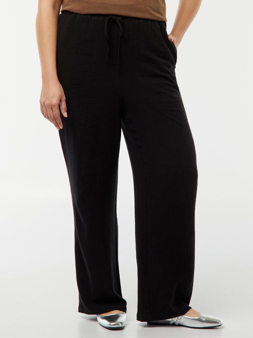 Calças de corte direito com cós elástico + atilhos - Kiabi Calças de corte direito com cós elástico + atilhos - Kiabi