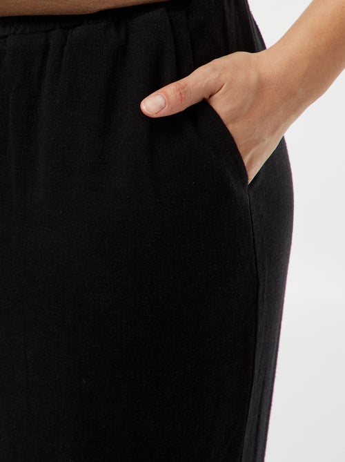 Calças de corte direito com cós elástico + atilhos - Kiabi Calças de corte direito com cós elástico + atilhos - Kiabi