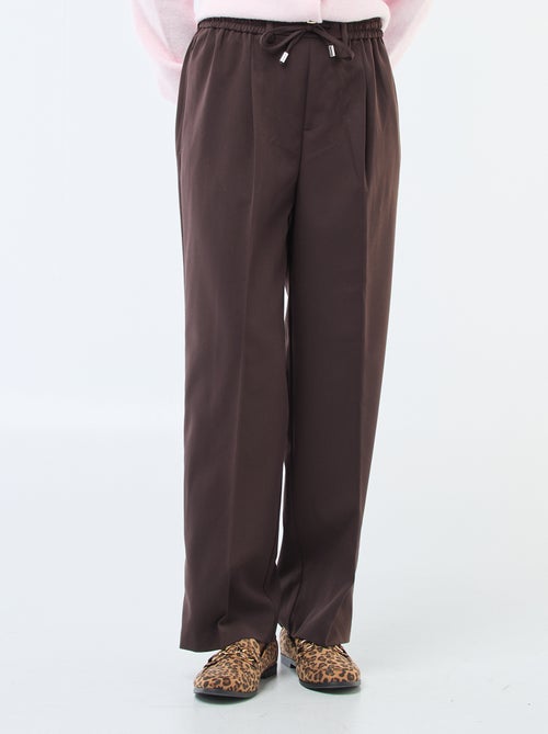 Calças de corte largo com cintura elástica + cordões para atar - Kiabi Calças de corte largo com cintura elástica + cordões para atar - Kiabi