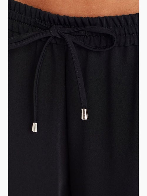 Calças de crepe de perna larga dilvin - Kiabi Calças de crepe de perna larga dilvin - Kiabi