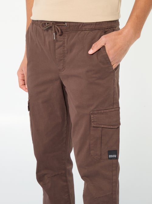 Calças de fato de treino com bolsos de aba - Kiabi Calças de fato de treino com bolsos de aba - Kiabi