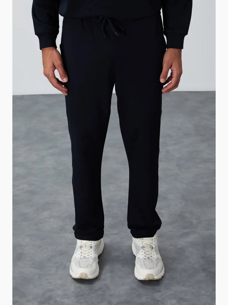 Calças de fato de treino de homem regular fit em mistura de algodão tommy Azul-lago - Kiabi