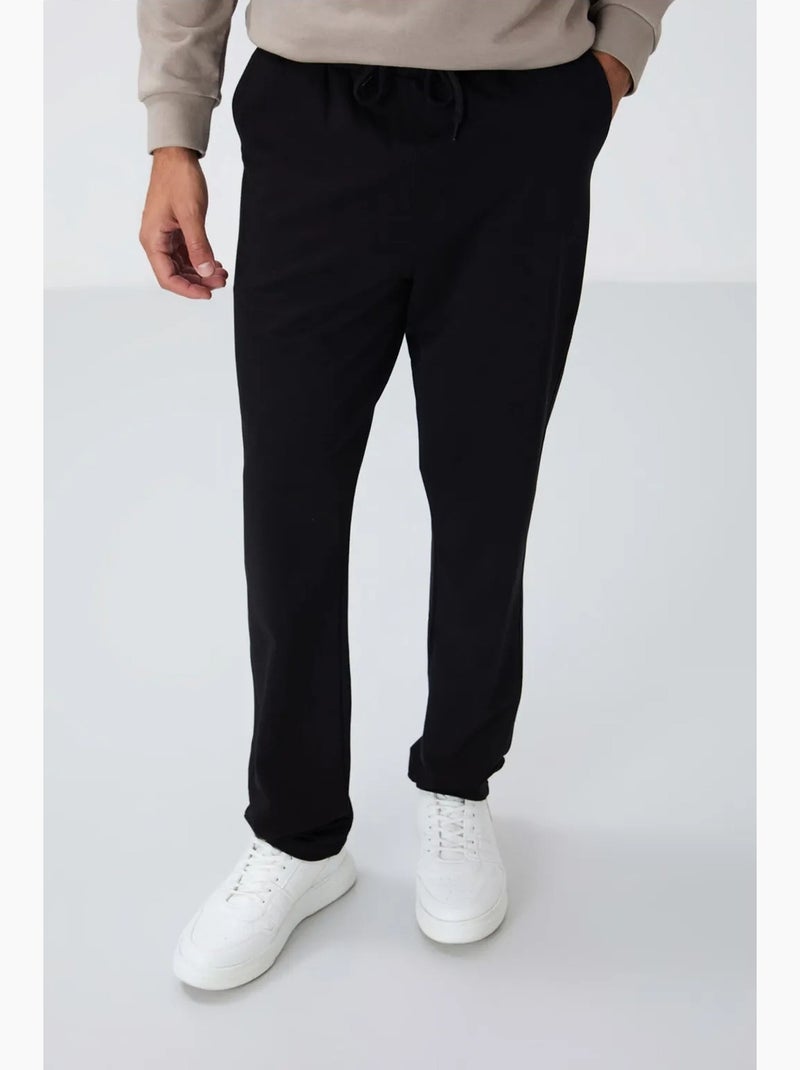 Calças de fato de treino de homem regular fit em mistura de algodão tommy Preto - Kiabi