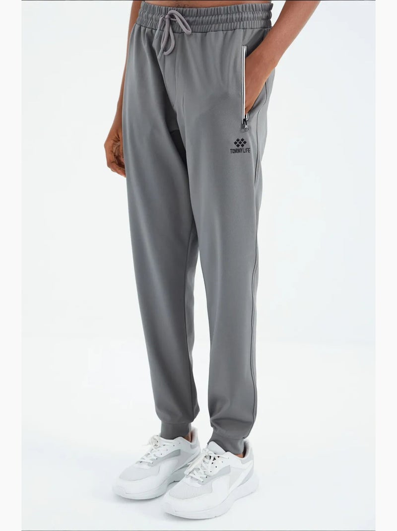 Calças de fato de treino de homem relaxed fit tommy Cinza - Kiabi