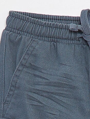 Calças de fato de treino de sarja com bolsos de aba