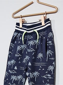 Calças de fato de treino estampado 'palmeira' - Kiabi