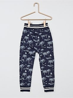 Calças de fato de treino estampado 'palmeira' - Kiabi