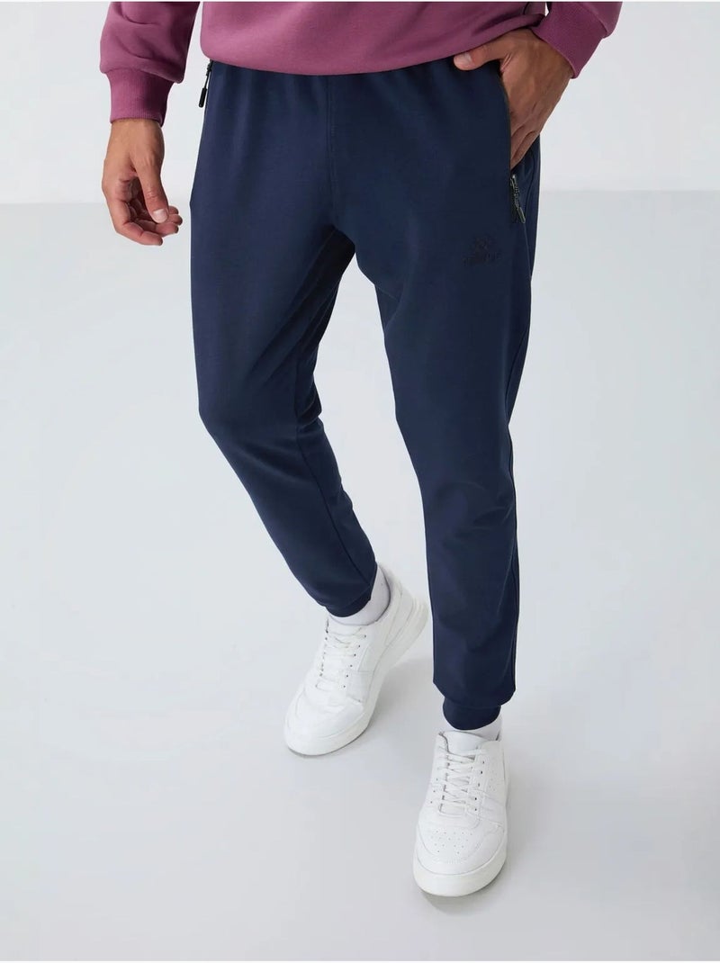 Calças de fato de treino jogger de homem com bolso com fecho tommy Azul-marinho - Kiabi