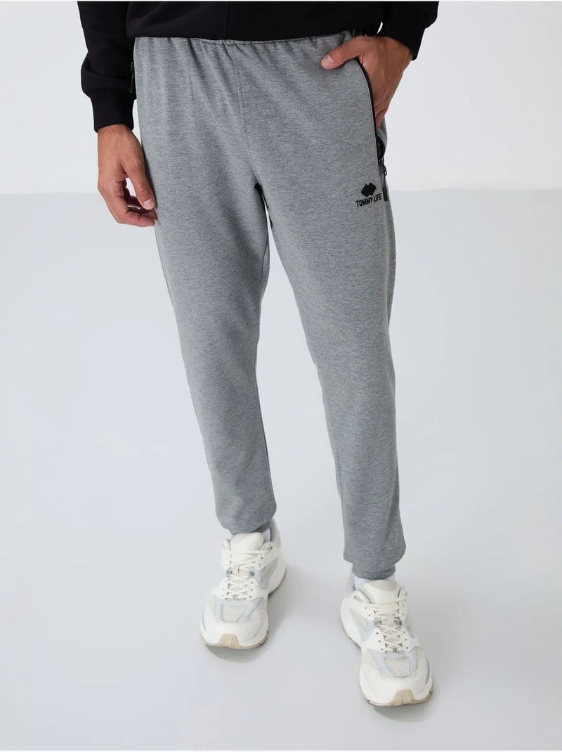 Calças de fato de treino jogger de homem com bolso com fecho tommy Cinza - Kiabi