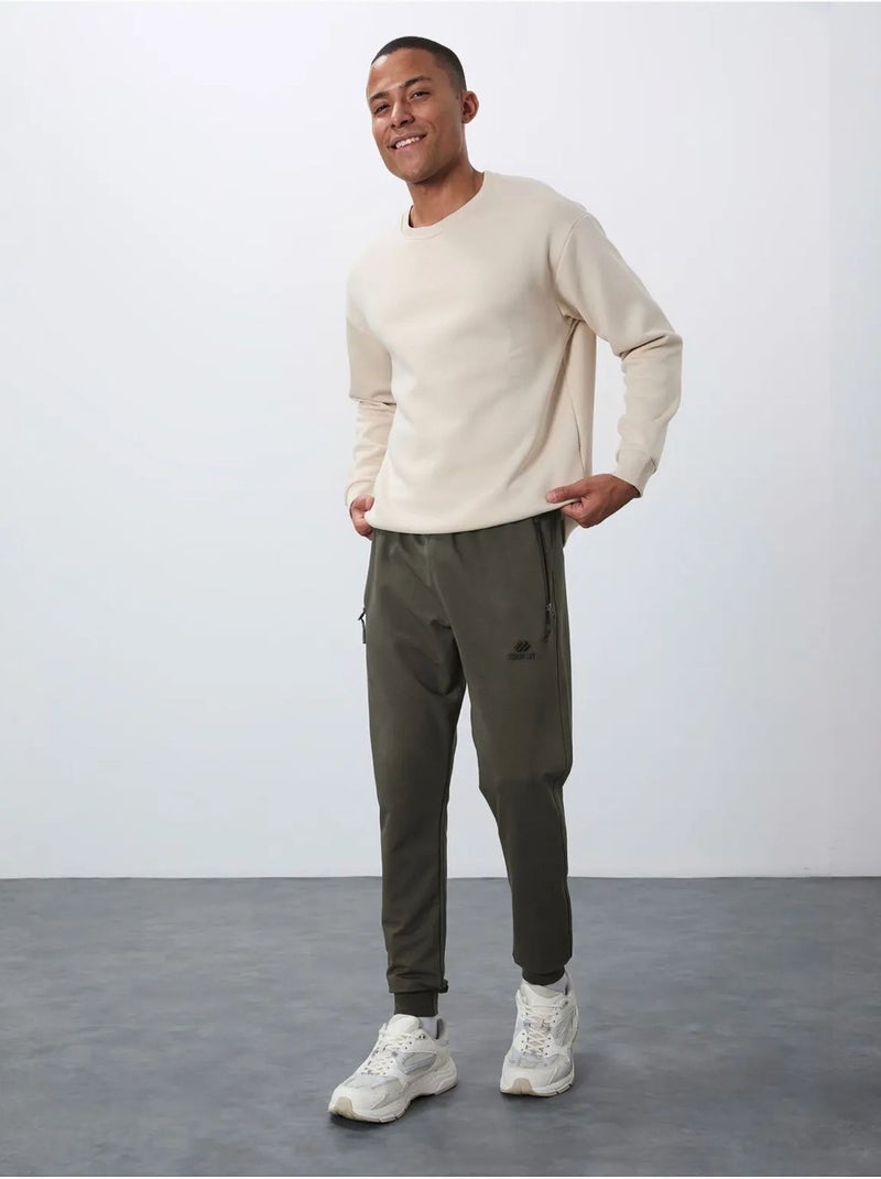 Calças de fato de treino jogger de homem com bolso com fecho tommy Verde cáqui - Kiabi