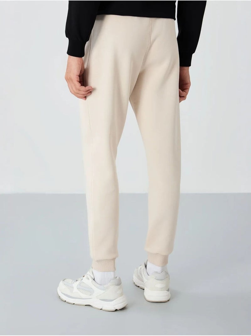 Calças de fato de treino jogger de homem tommy Bege natural - Kiabi