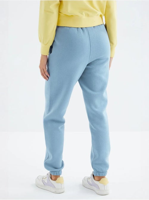 Calças de fato de treino jogger em fleece de cintura subida para mulher tommy - Kiabi Calças de fato de treino jogger em fleece de cintura subida para mulher tommy - Kiabi