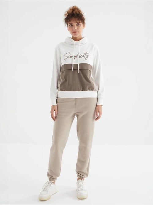 Calças de fato de treino jogger em fleece de cintura subida para mulher tommy - Kiabi Calças de fato de treino jogger em fleece de cintura subida para mulher tommy - Kiabi