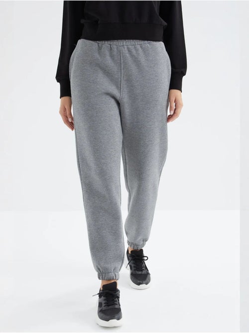 Calças de fato de treino jogger em fleece de cintura subida para mulher tommy - Kiabi Calças de fato de treino jogger em fleece de cintura subida para mulher tommy - Kiabi