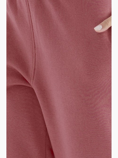 Calças de fato de treino jogger em fleece de cintura subida para mulher tommy - Kiabi Calças de fato de treino jogger em fleece de cintura subida para mulher tommy - Kiabi