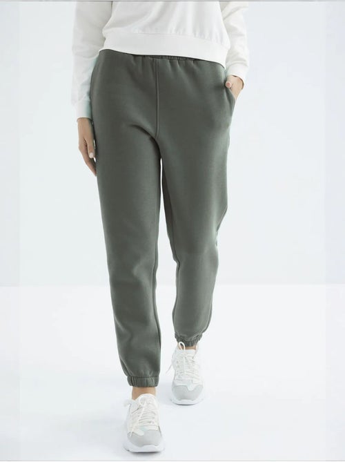 Calças de fato de treino jogger em fleece de cintura subida para mulher tommy - Kiabi Calças de fato de treino jogger em fleece de cintura subida para mulher tommy - Kiabi