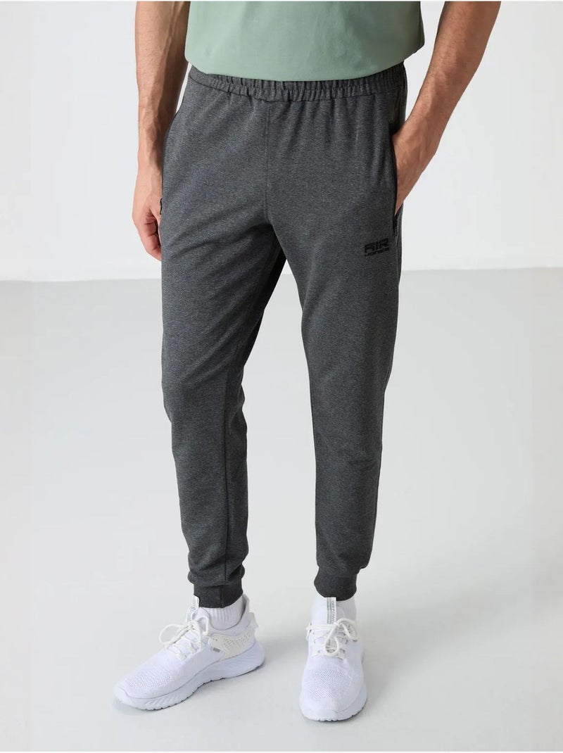 Calças de fato de treino jogger lisas para homem tommy Cinza-preto - Kiabi