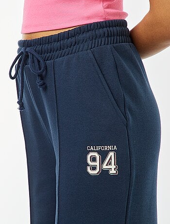 Calças de fato de treino largas com estampado sportswear