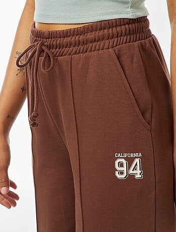 Calças de fato de treino largas com estampado sportswear