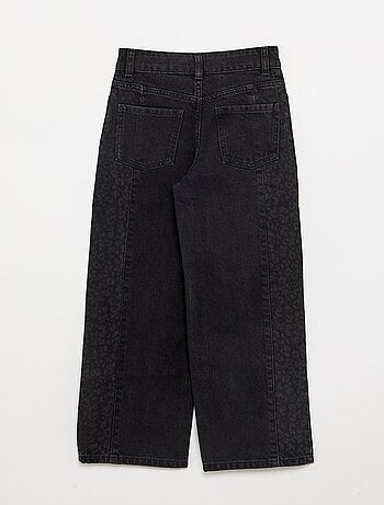 Calças de ganga com aplicações estampadas