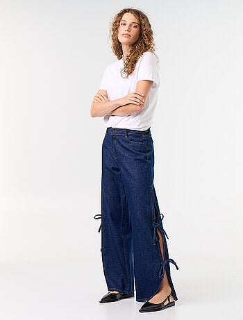 Calças de ganga wide leg largas com laços fantasia na bainha