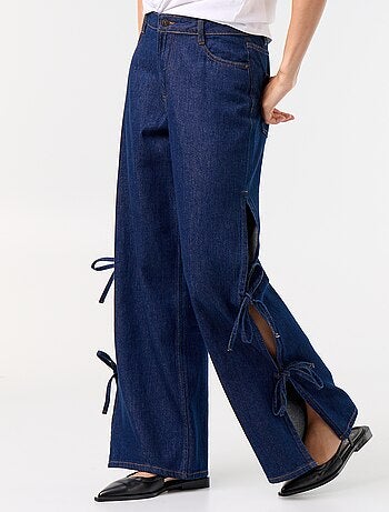 Calças de ganga wide leg largas com laços fantasia na bainha