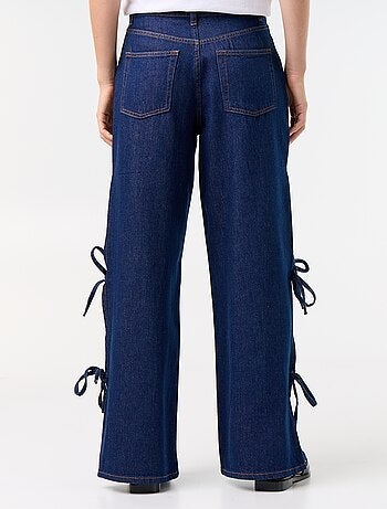 Calças de ganga wide leg largas com laços fantasia na bainha