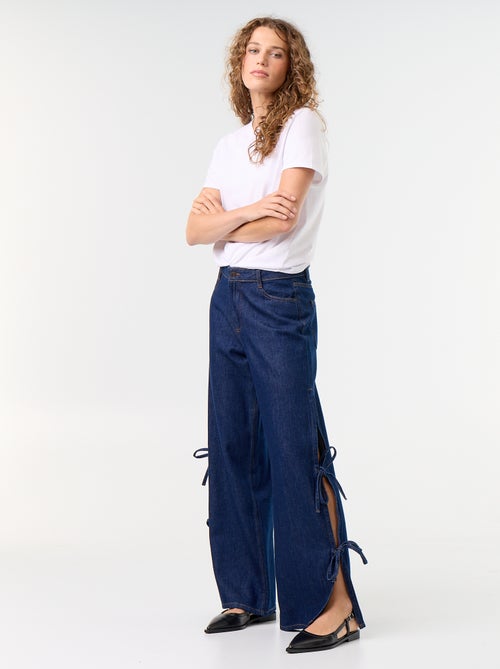 Calças de ganga wide leg largas com laços fantasia na bainha - Kiabi Calças de ganga wide leg largas com laços fantasia na bainha - Kiabi