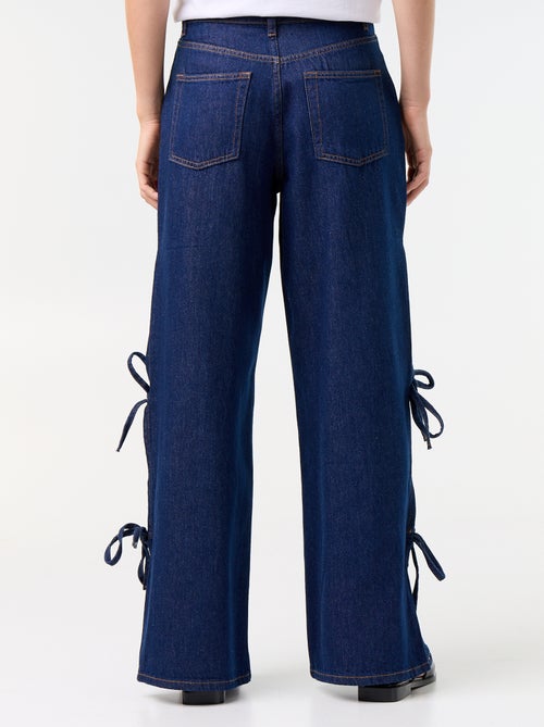 Calças de ganga wide leg largas com laços fantasia na bainha - Kiabi Calças de ganga wide leg largas com laços fantasia na bainha - Kiabi