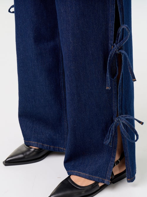 Calças de ganga wide leg largas com laços fantasia na bainha - Kiabi Calças de ganga wide leg largas com laços fantasia na bainha - Kiabi