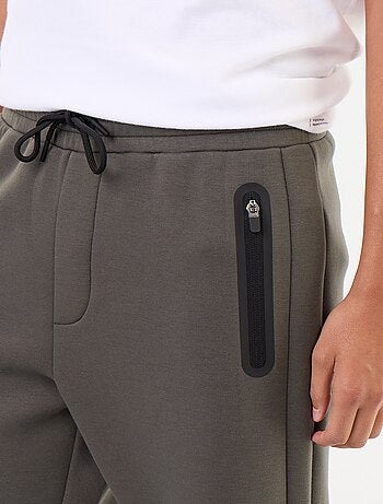 Calças de jogging com bolsos com fecho
