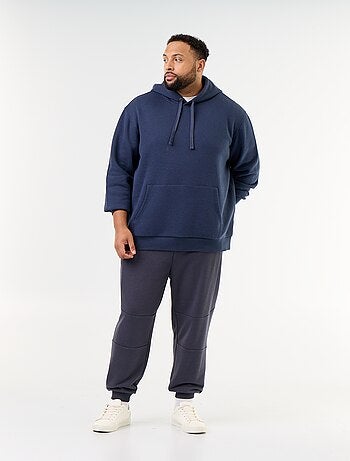 Calças de jogging com punho elástico e bolsos com fecho