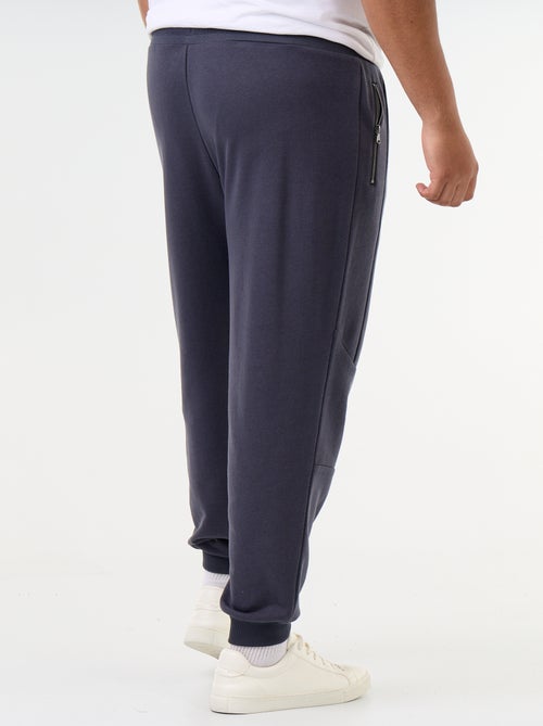 Calças de jogging com punho elástico e bolsos com fecho - Kiabi