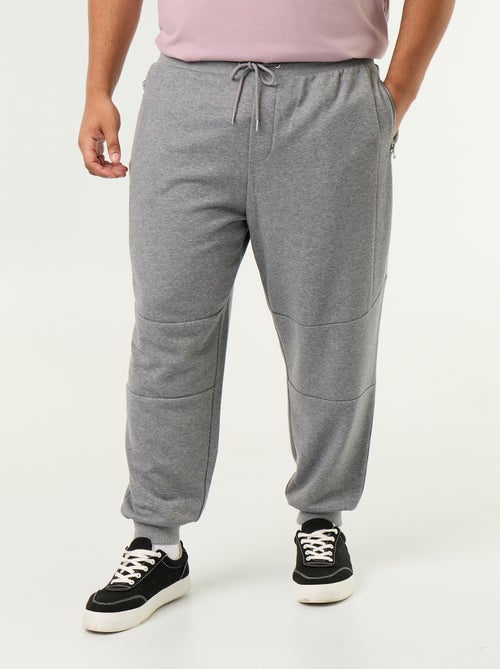 Calças de jogging com punho elástico e bolsos com fecho - Kiabi Calças de jogging com punho elástico e bolsos com fecho - Kiabi