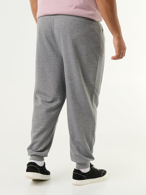 Calças de jogging com punho elástico e bolsos com fecho - Kiabi Calças de jogging com punho elástico e bolsos com fecho - Kiabi