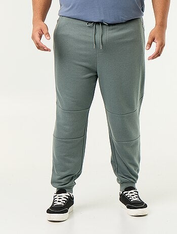 Calças de jogging com punho elástico e bolsos com fecho