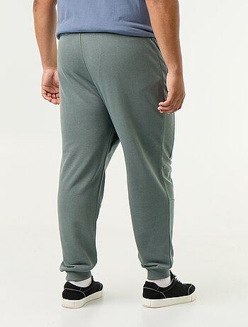 Calças de jogging com punho elástico e bolsos com fecho
