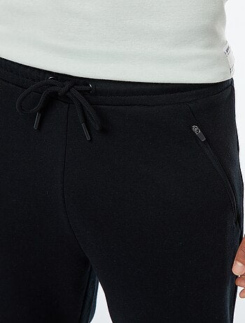 Calças de jogging em moletom leve com bolsos com zíper