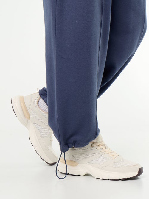 Calças de jogging largas desportivas - Kiabi Calças de jogging largas desportivas - Kiabi