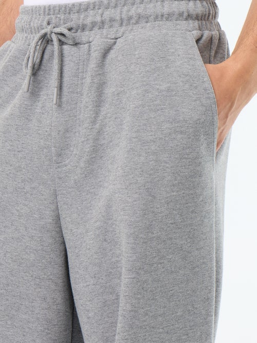 Calças de jogging largas em moletão leve - Kiabi Calças de jogging largas em moletão leve - Kiabi