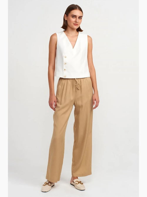 Calças de mulher em tencel de perna larga com cintura com cordão dilvin - Kiabi Calças de mulher em tencel de perna larga com cintura com cordão dilvin - Kiabi