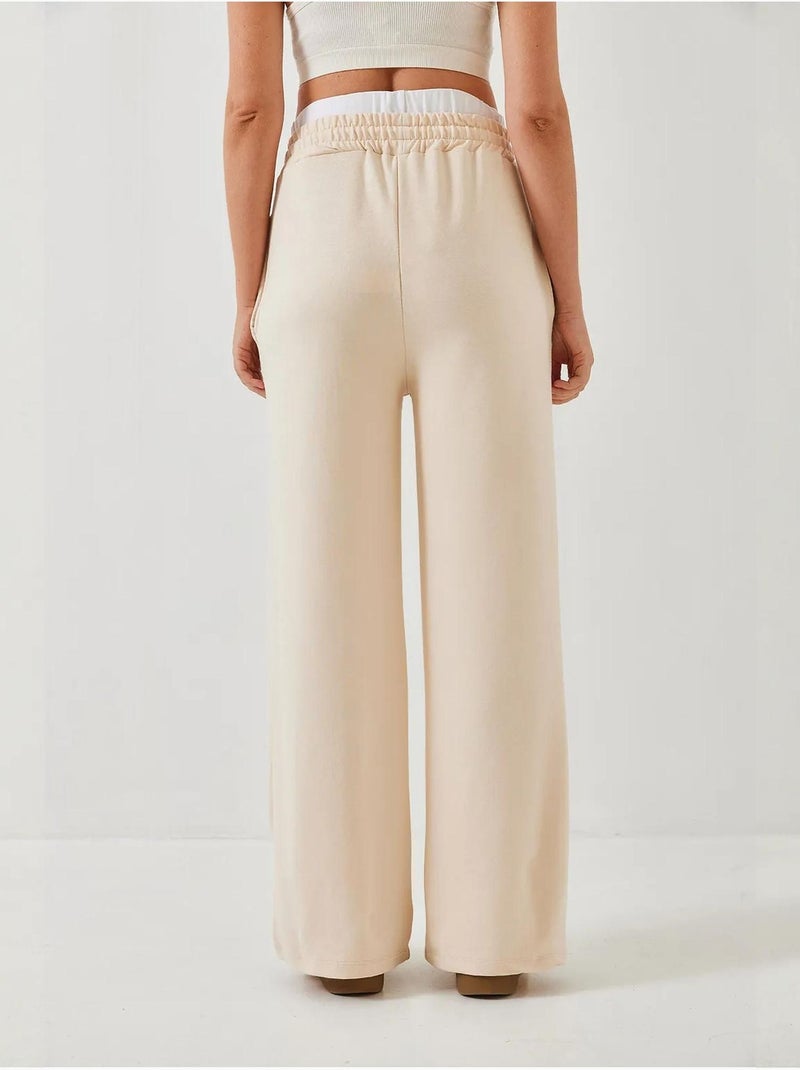Calças de perna larga com detalhe de cinto lucci Bege-argila - Kiabi