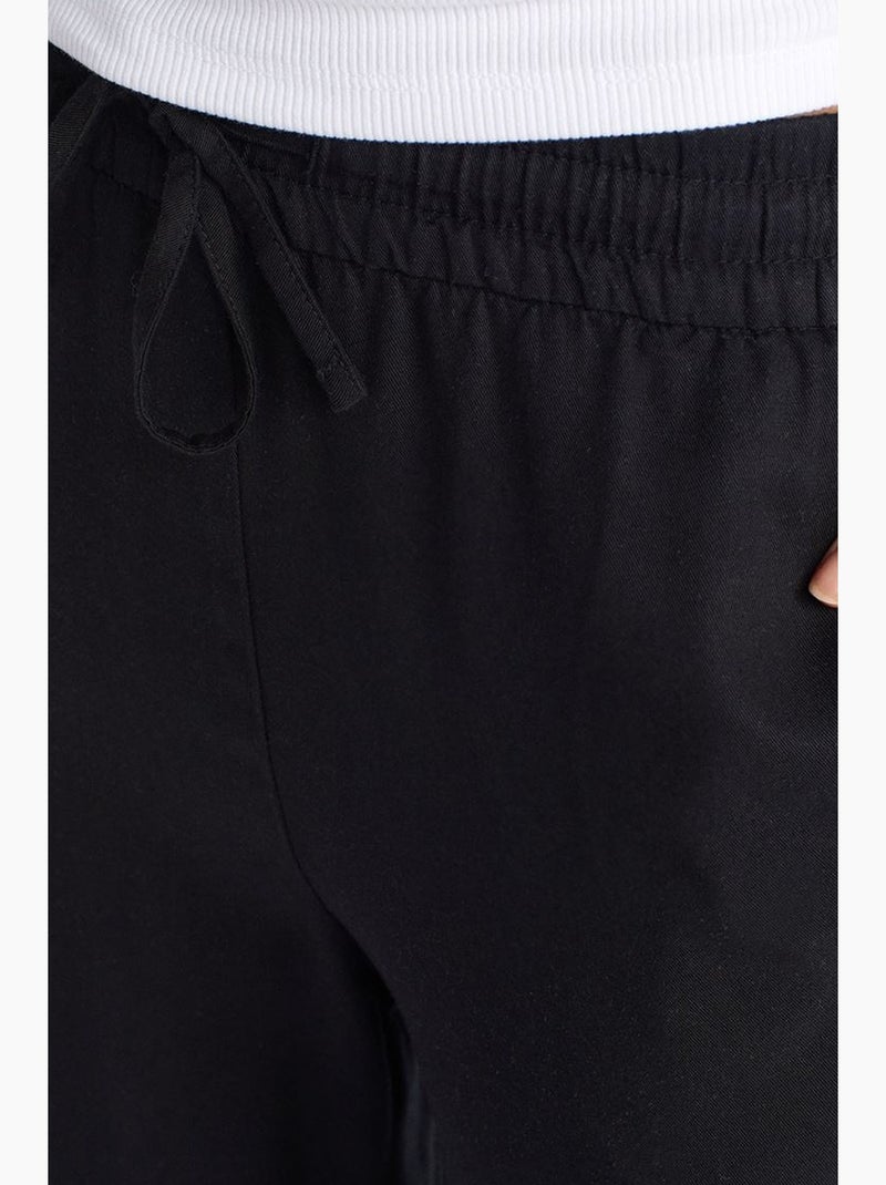Calças de perna larga em tencel com cintura com cordão dilvin Preto - Kiabi