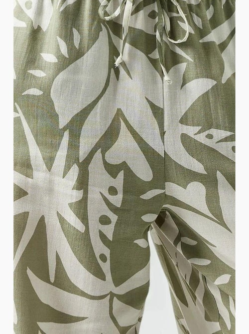 Calças de perna reta com estampado floral hiccup - Kiabi Calças de perna reta com estampado floral hiccup - Kiabi