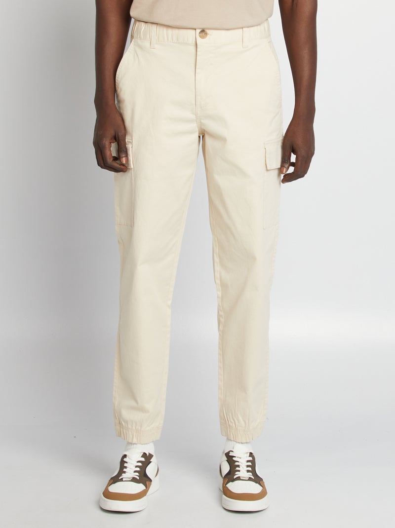 Calças elásticas com vários bolsos bege - Kiabi
