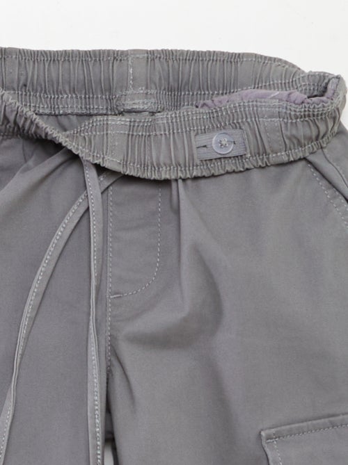 Calças elásticas com vários bolsos - Kiabi