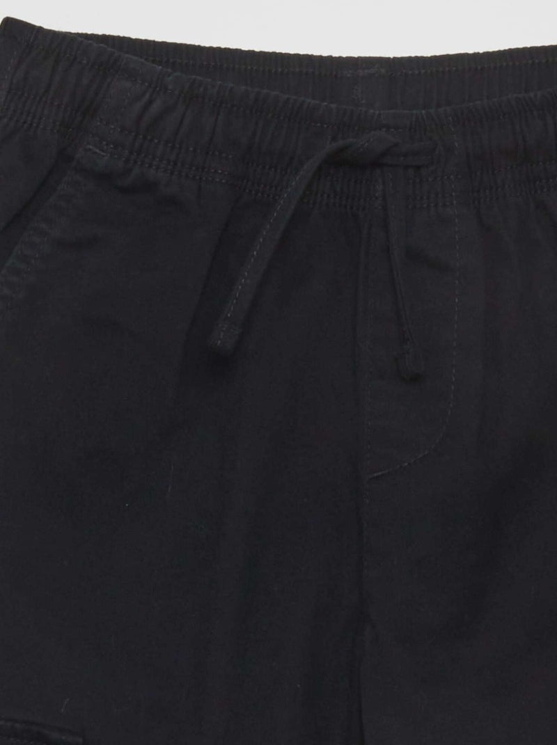 Calças elásticas com vários bolsos Preto - Kiabi