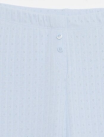 Calças em malha com padrão de renda