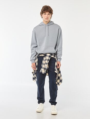 Calças estilo 'jogger' com vários bolsos