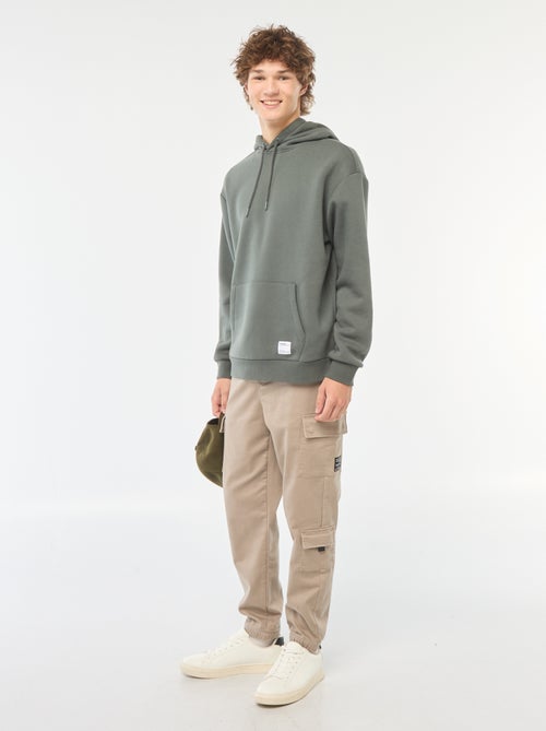 Calças estilo 'jogger' com vários bolsos - Kiabi